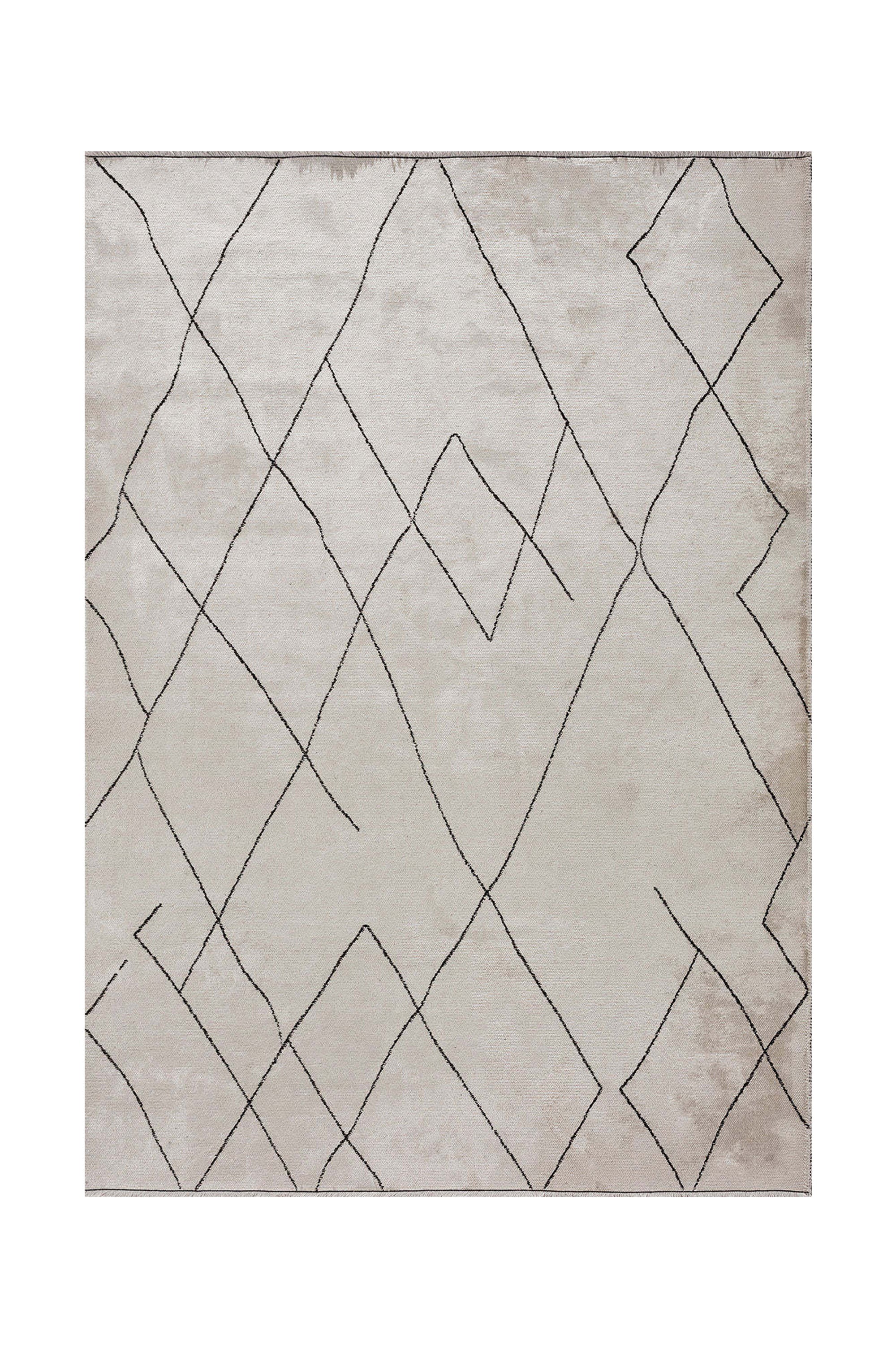Beige rug with abstract line pattern.