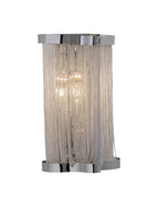 Skulpta Wall Sconce featuring a polished silver aluminum frame with cascading metal chain detailing, shown illuminated on a white background, emphasizing its modern sculptural form and soft ambient glow.