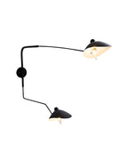 Fleur de Noir Wall Sconce with a matte black finish, featuring an elongated sculptural arm and two opposing dome-shaped shades, shown illuminated against a white background.