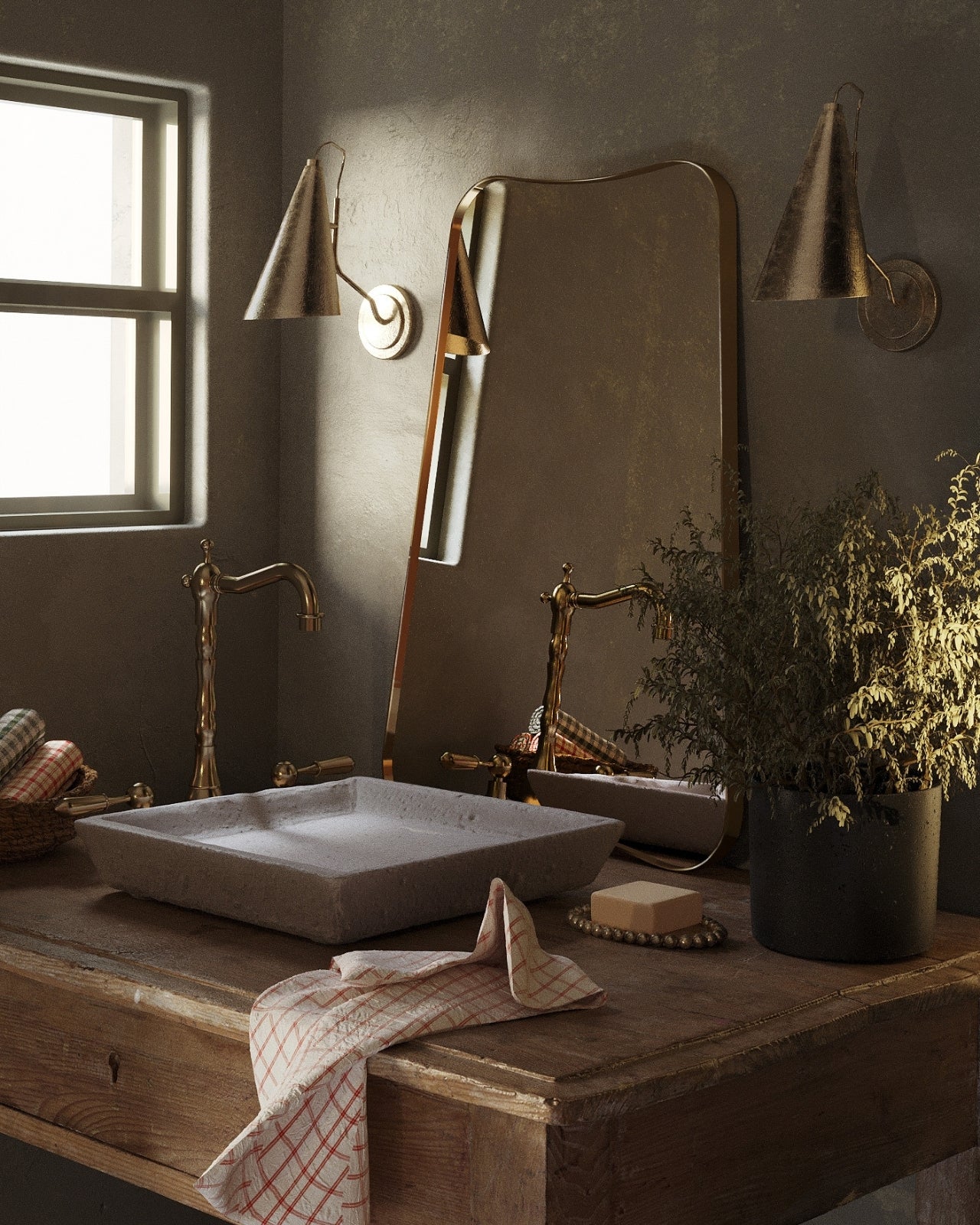 Butterfly Mirror with a softly curved, wing-inspired silhouette placed above a countertop sink, styled with vintage-style wall lights, greenery, and folded textiles in a warm, moody bathroom setting.