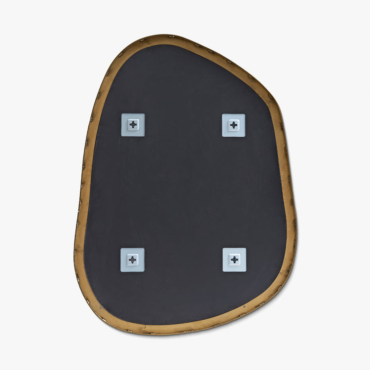 Back view of an asymmetrical mirror showing rear mounting brackets and brass-colored frame.