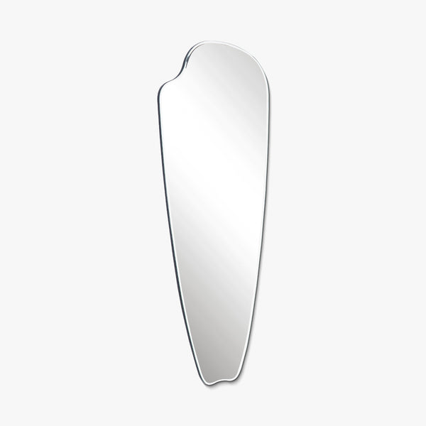 Frameless elongated wall mirror with an organic pebble-inspired silhouette, shown on a white background.