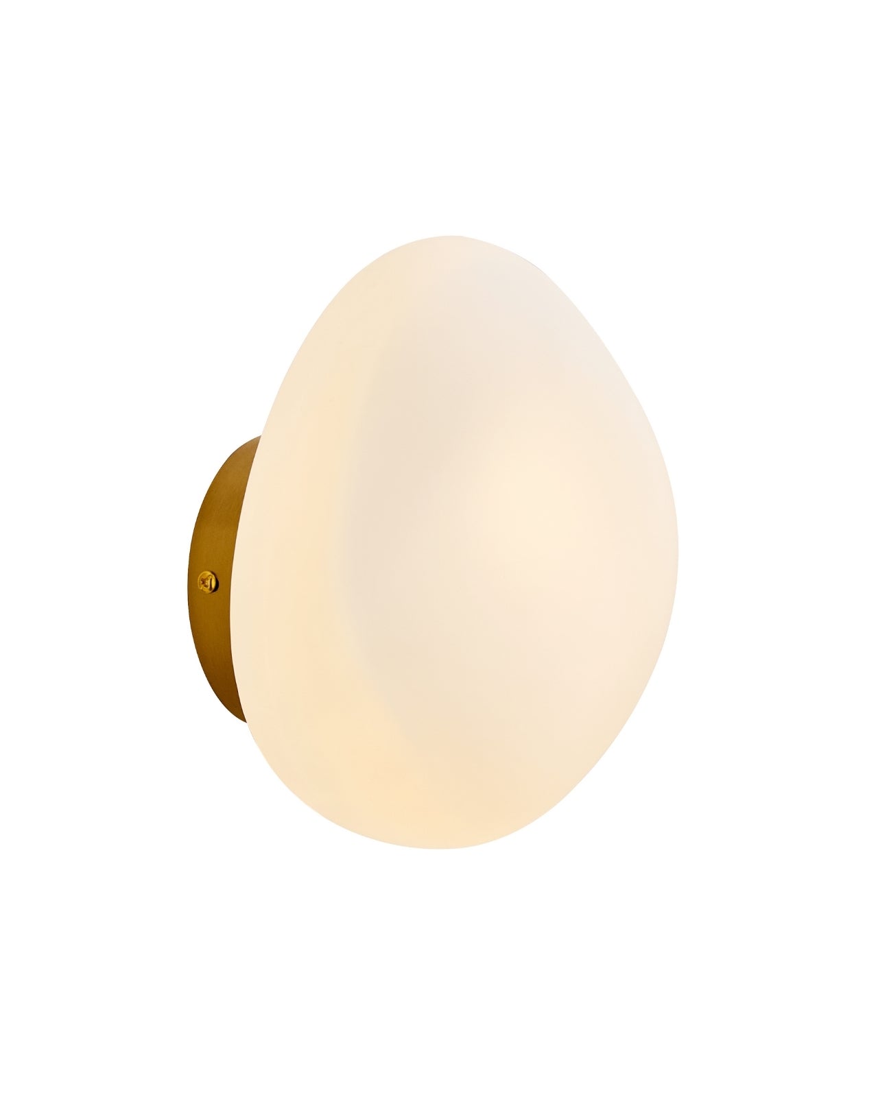 Brass wall sconce with an oval opaque white glass shade mounted on a round brass backplate.