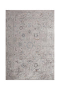 Handcrafted flat-woven rug with a muted gray and blue pattern and subtle vintage detailing.