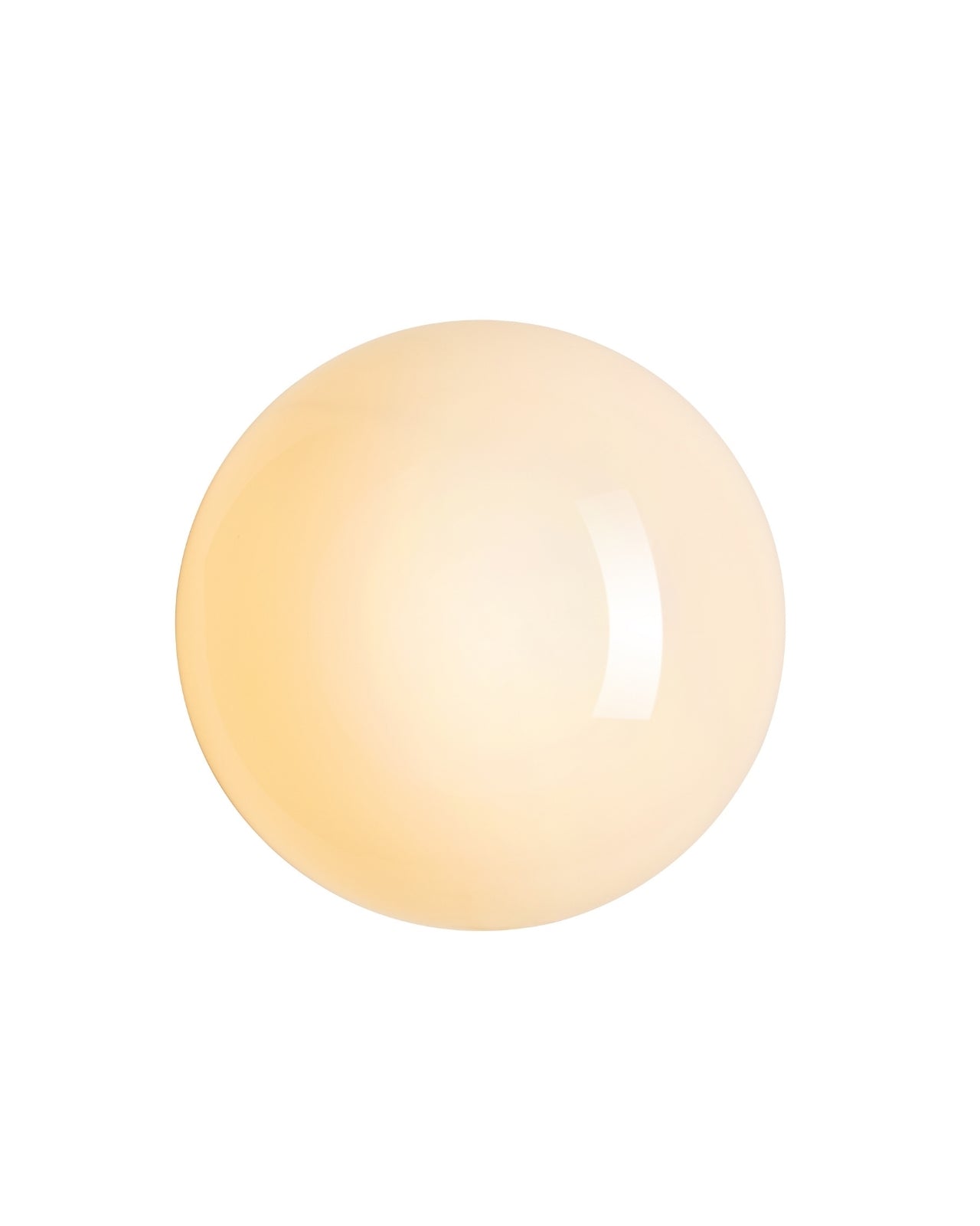 Wall-mounted sconce with a round, opaque white glass shade emitting a warm white light.