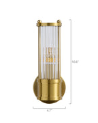 Wall-mounted brass sconce with a cylindrical clear glass shade featuring vertical ribbed texture, shown against a white background, measuring approximately 10.6 inches in height and 4.7 inches in depth.