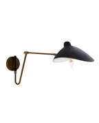 Adjustable wall-mounted sconce with a black dome-shaped metal shade and brass articulated arm, shown from the side against a white background, with an exposed bulb directing light downward.