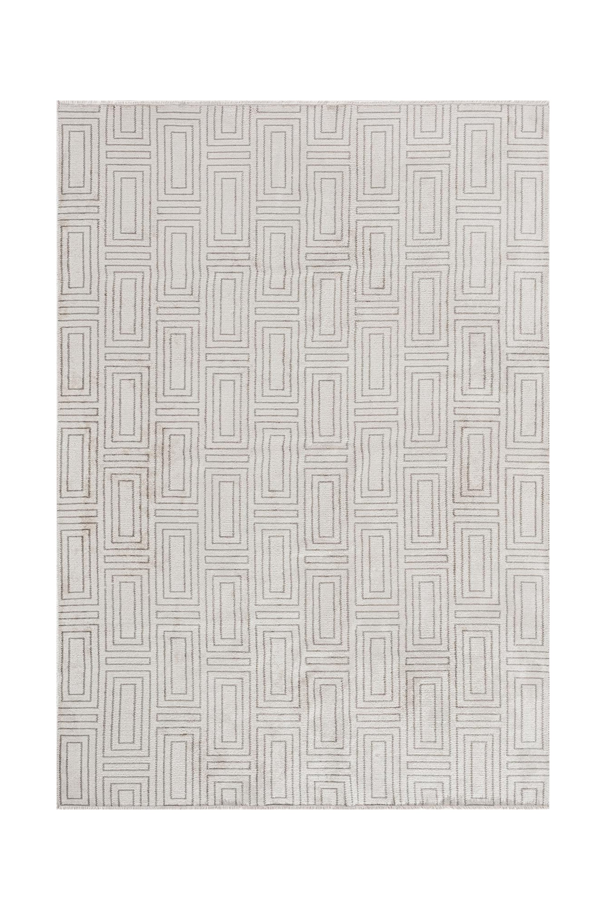 Geometric patterned rug in soft neutral tones.
