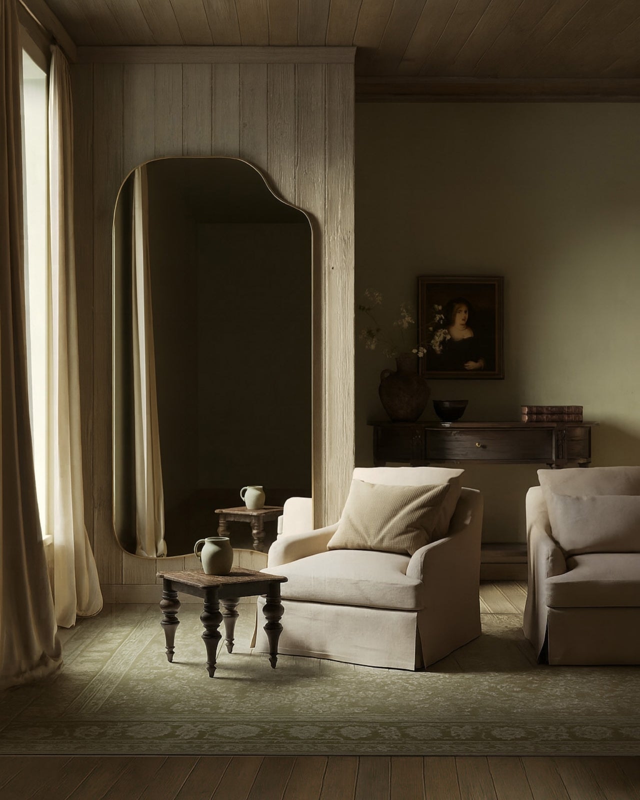 Asymmetrical full-length mirror with an organic shape and thin brass-colored frame, styled in a classic living room with upholstered armchairs, wood paneling, and soft natural light.