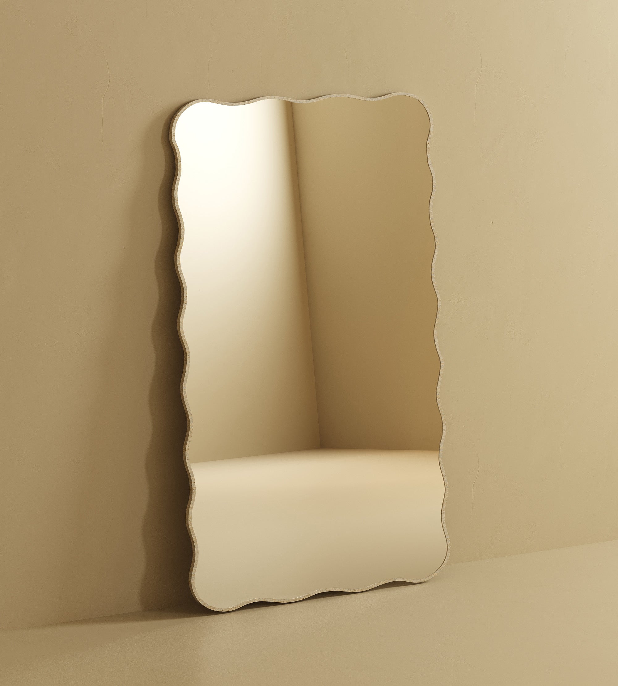 Full-length rectangular wall mirror with softly wavy edges and a light stone-look edge, shown in a vertical orientation.