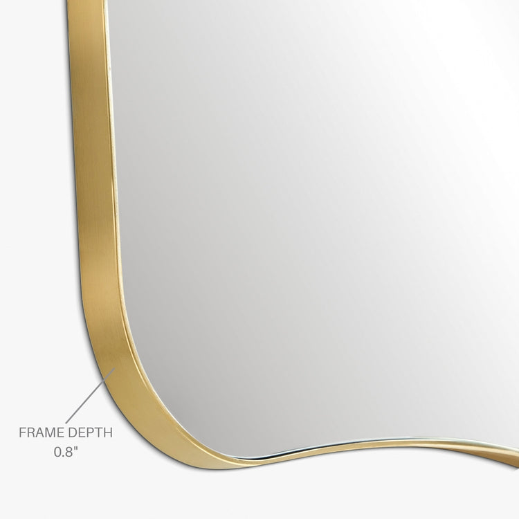 Asymmetrical mirror close-up showing a thin brass-colored metal frame with a labeled 0.8-inch frame depth on a white background.