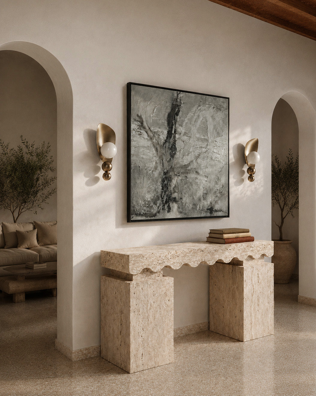 Decorative console table in a living room with a large abstract painting on the wall.