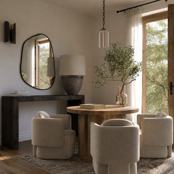 Modern dining room with wooden table, beige chairs, and large mirror on the wall.