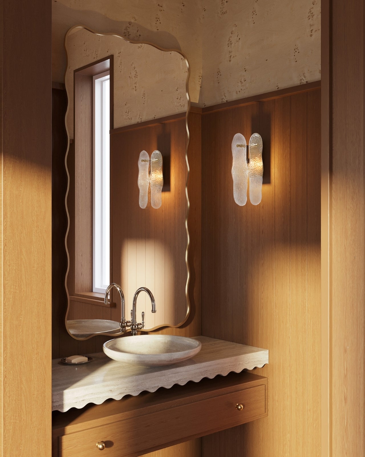 Full-length rectangular wall mirror with a gold frame and softly wavy edges, mounted vertically above a bathroom vanity.
