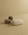 Pebble ottoman set with rounded shapes in neutral colors on a plain background.