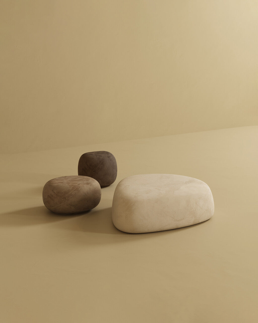 Pebble ottoman set with rounded shapes in neutral colors on a plain background.