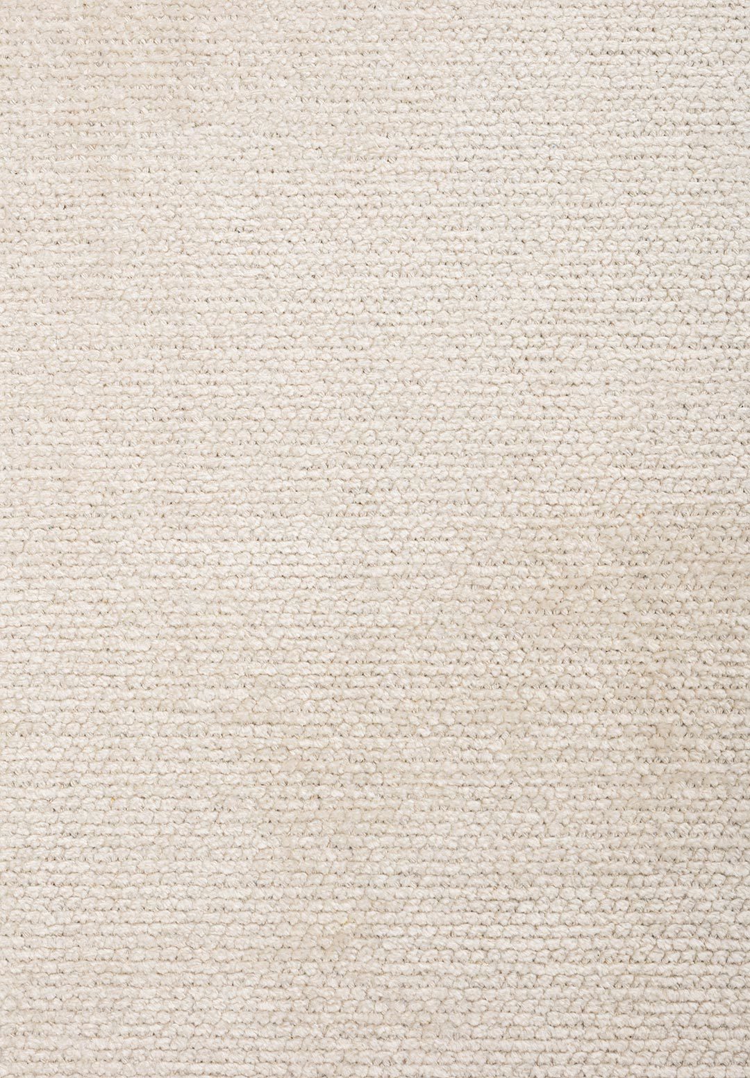 Close-up of almost white flat-woven rug.