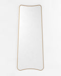 Tall full-length mirror with a narrow rectangular form and gently curved top and bottom edges, shown vertically against a plain light background.