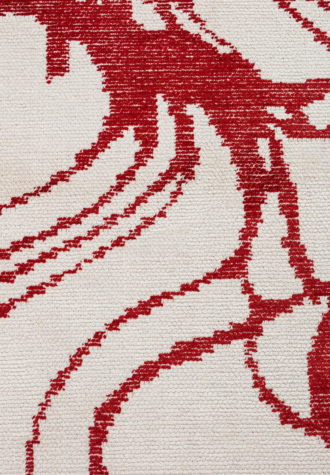 Flat-woven area rug with flowing red abstract lines on a cream-colored background.