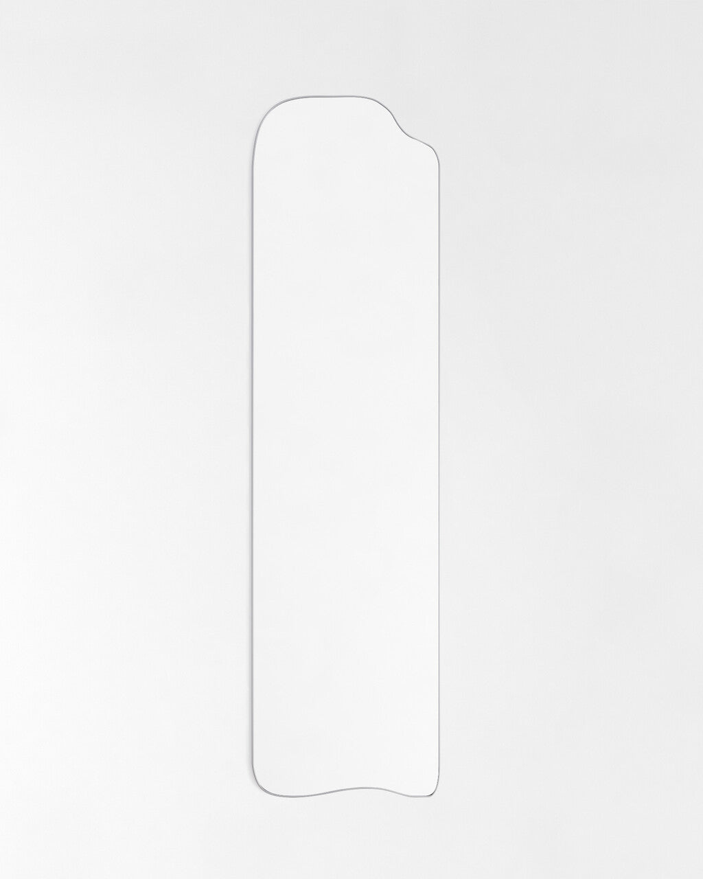 Asymmetrical full-length mirror with an organic silhouette and thin frame, shown against a plain white background.