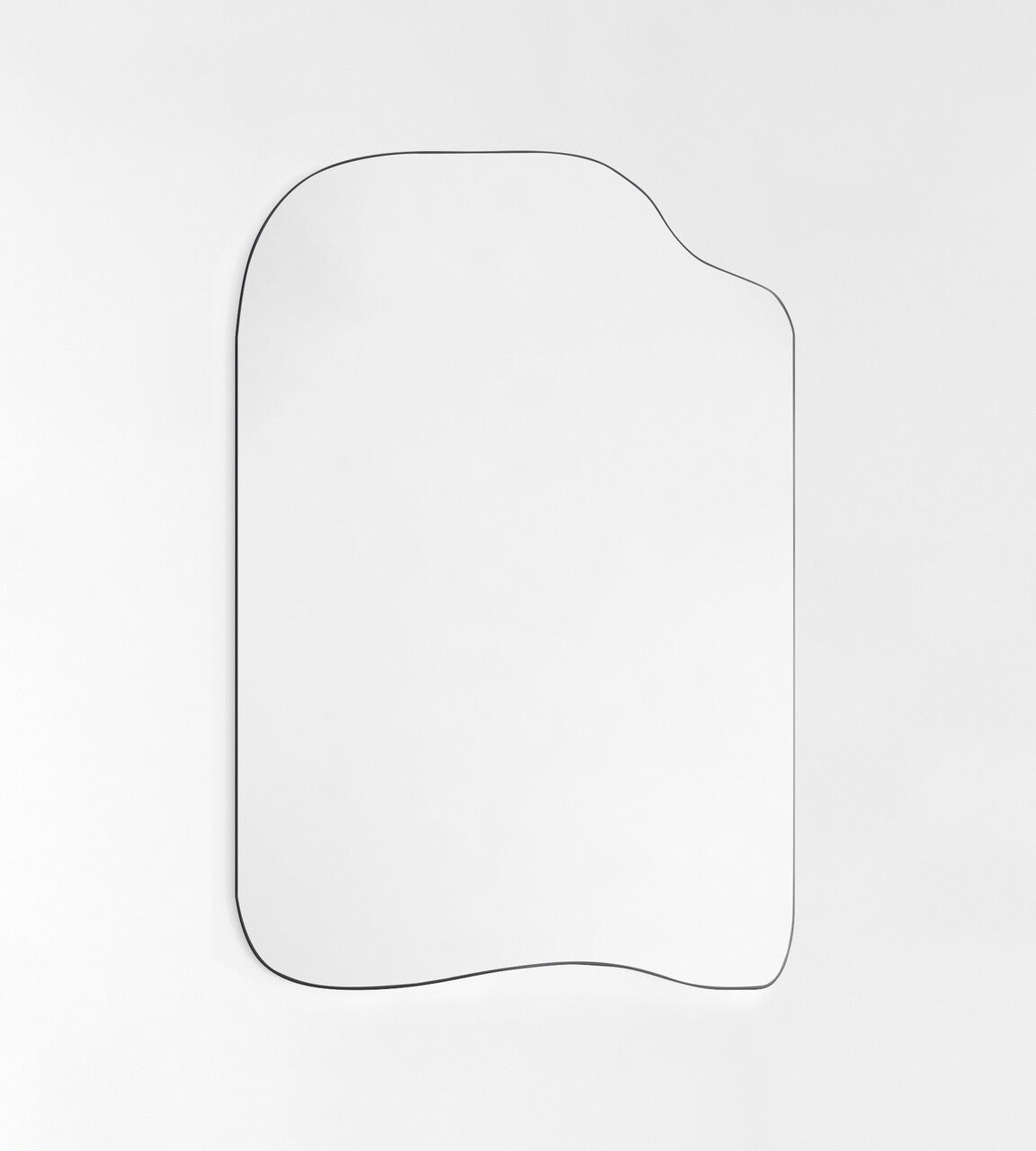 Asymmetrical wall mirror with a thin black metal frame on a white background.
